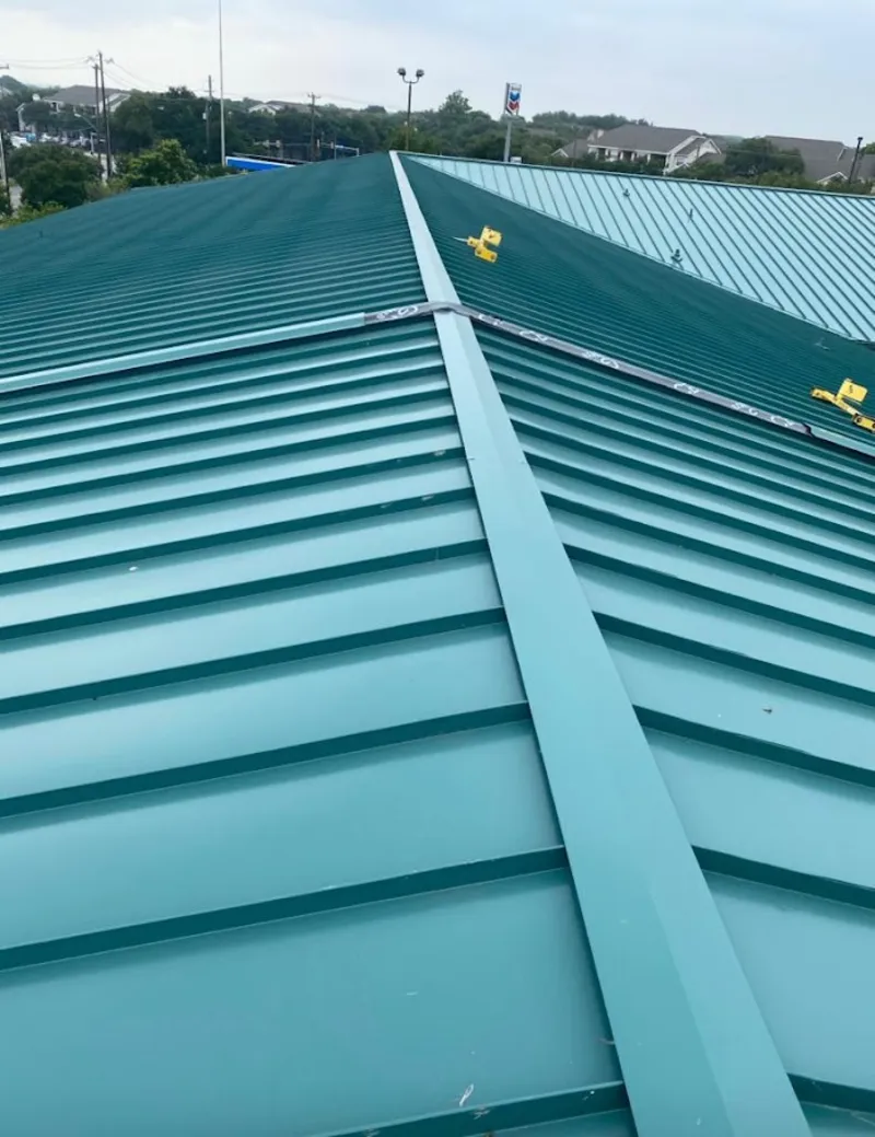 Green commercial metal roof ridge and valley for Metal Roof Repair in Alfred